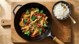 Sautéed oyster mushrooms with vegetables and rice